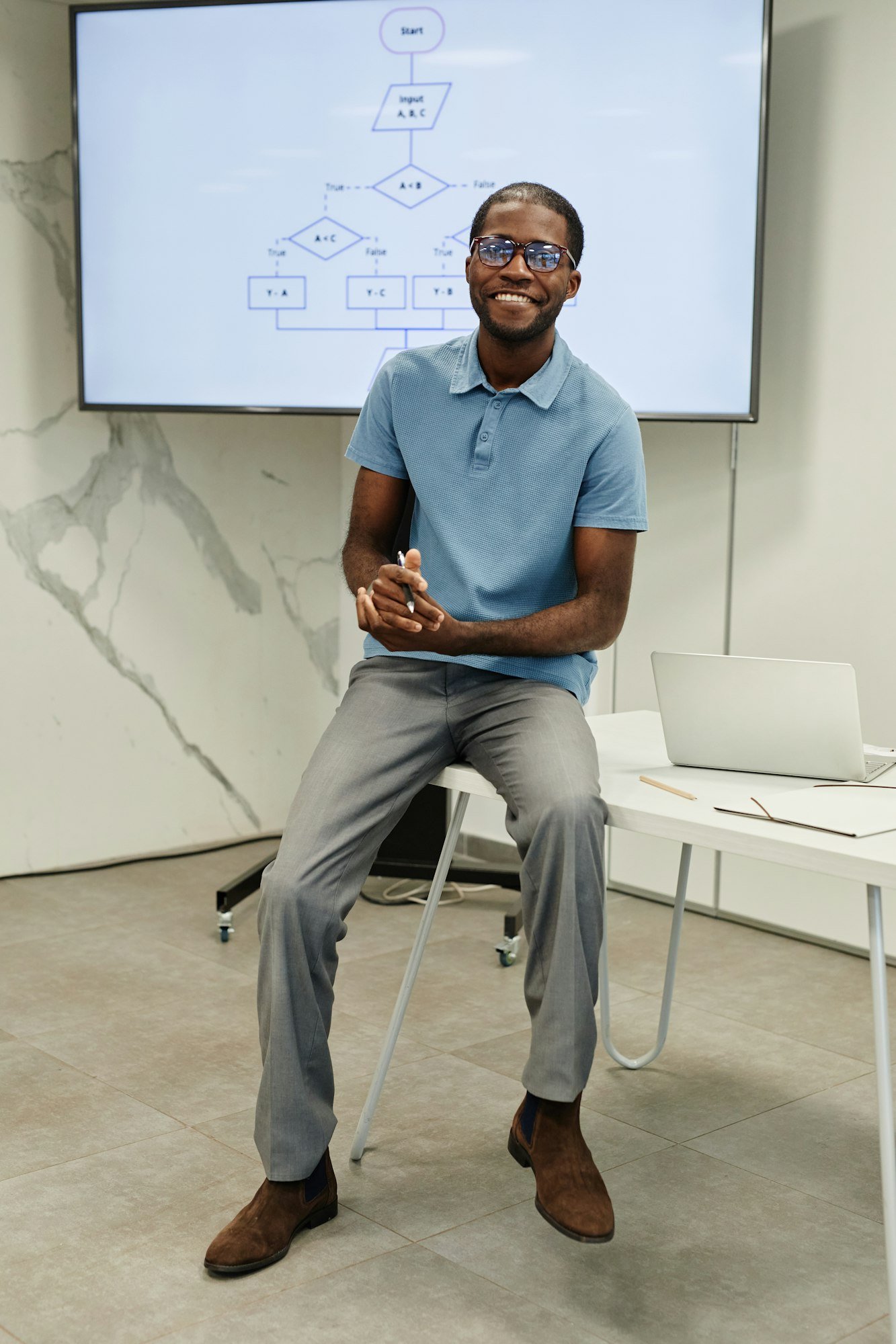 Smiling Teacher in Coding Class