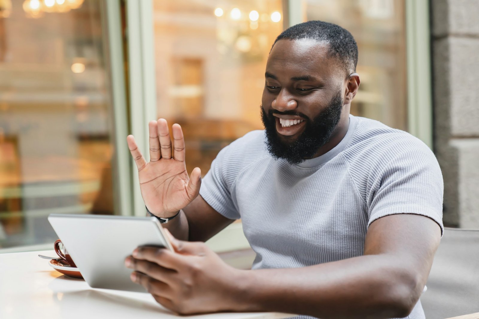 Young african male student freelancer businessman talking on video call conversation online